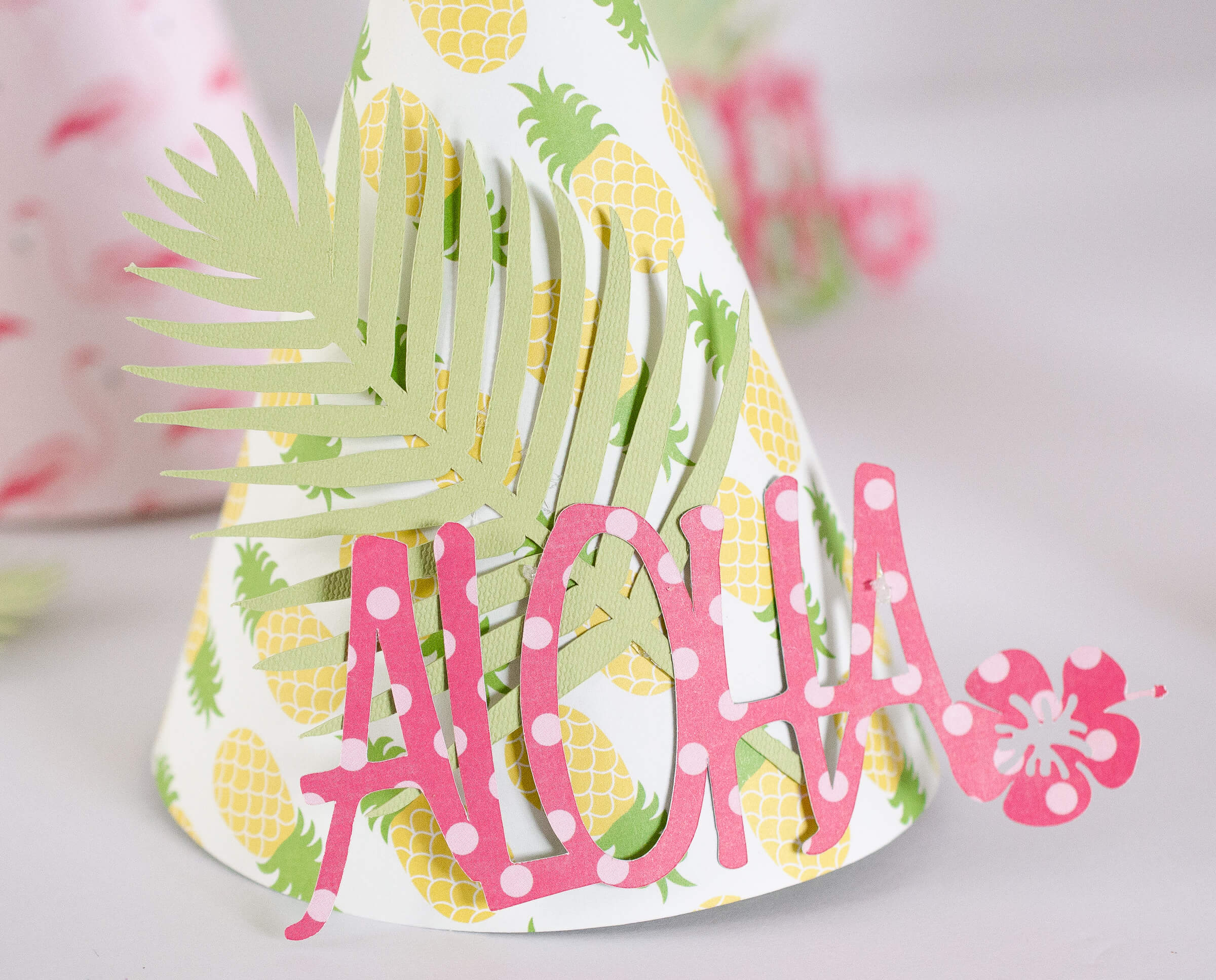 Learn how to make these colorful tropical Party Hats by Fawn Prints on Love the Day