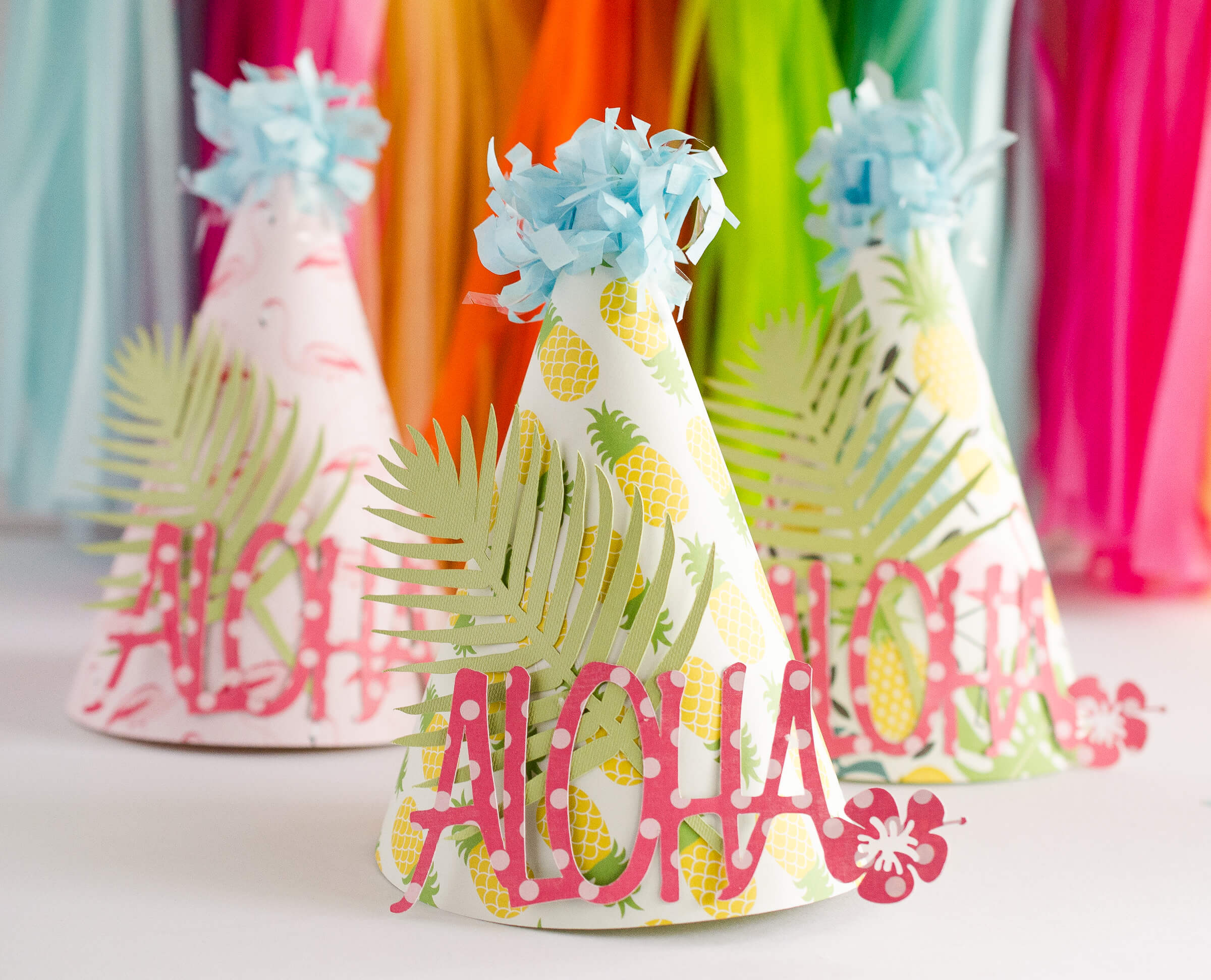 Learn how to make these colorful tropical Party Hats by Fawn Prints on Love the Day